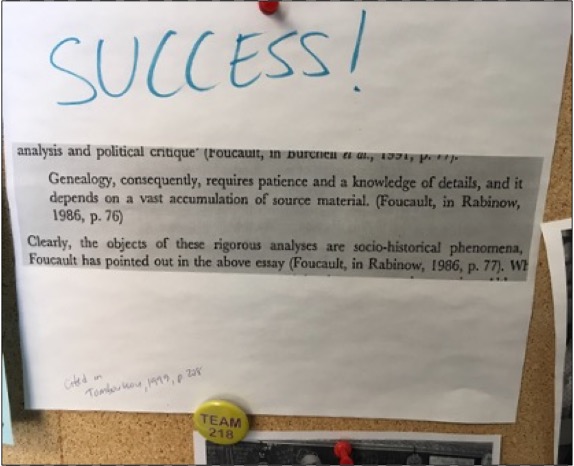 Picture of the bulletin board in Jeff's office of a quote from Tamboukou 1999, which cited Founcault's comment describing genealogical research as the "a vast accumulation of source material"